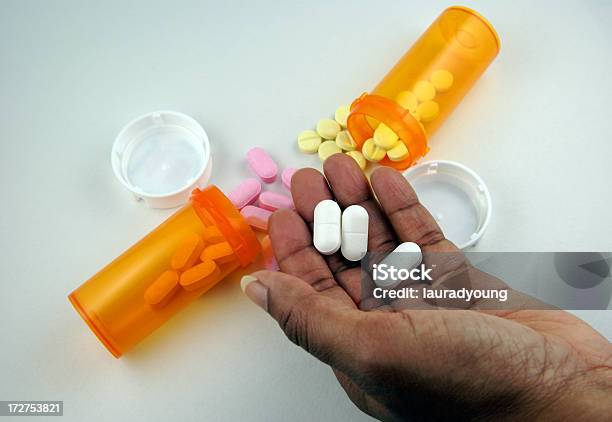 Africanamerican Hand Holding Medication Stock Photo - Download Image Now - African Ethnicity, African-American Ethnicity, Beauty