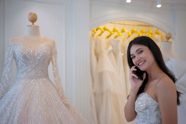istock The bride try on her dress at studio. 1727539288