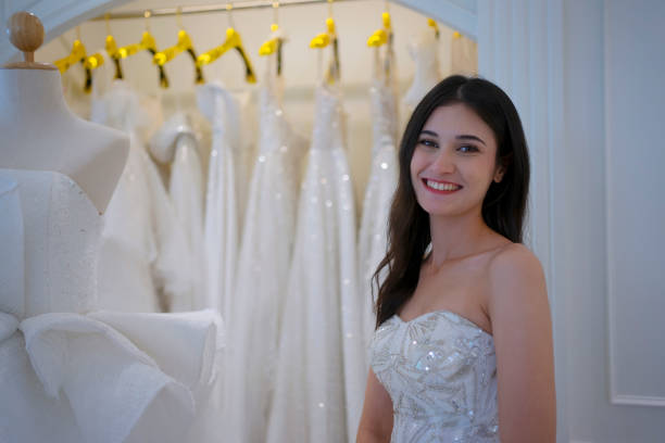 istock The bride try on her dress at studio. 1727539835
