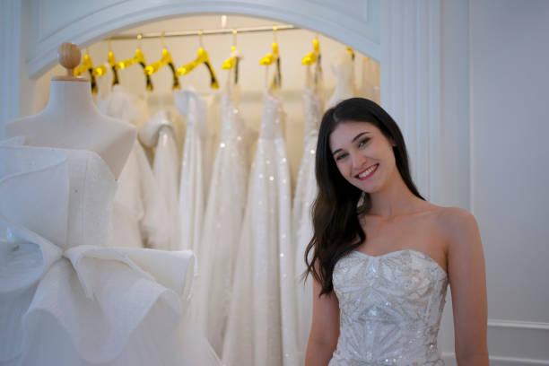 istock The bride try on her dress at studio. 1727539961