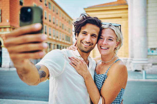 happy millennials discovering the charm of southern france, enjoying the coastal city of nice. - nice looking imagens e fotografias de stock