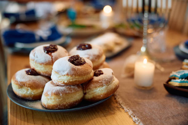 istock Traditional Jewish sufganiyah donuts during Hanukkah celebration. 1727542843