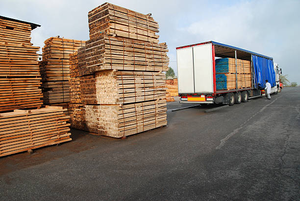 istock Stacks of timber and loaded truck 172754397