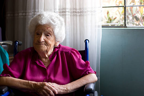 Portrait of an elderly woman in a wheelchair stock photo