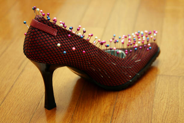 Needles in high heels; beauty is pain. Selective focus.