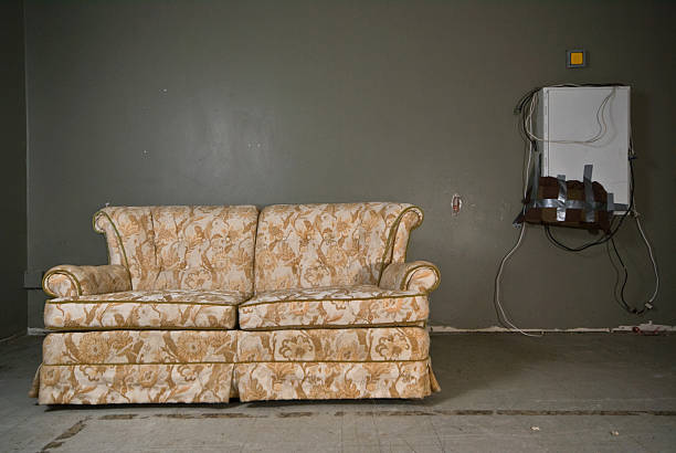 derelict couch stock photo