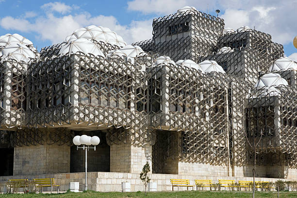 National Library of Kosovo Pristina, Kosovo: National library built in 1982 by the Croatian architect Andrija Mutnjakovic. The building, featuring a total of 99 white glass cupolas and entirely covered in wire netting, is said to represent the human brain and knowledge. pristina stock pictures, royalty-free photos & images