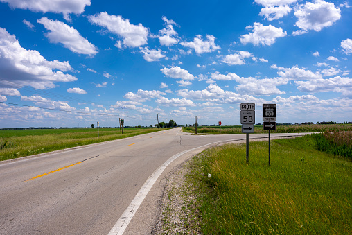 American road in Illinois with signs for route 66