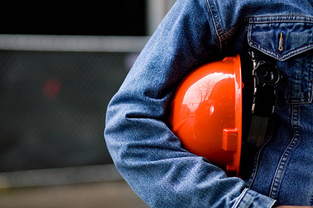 istock Construction worker in blue jean jacket with orange hard hat 172757656