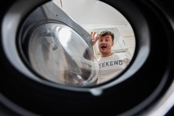 istock Man view from washing machine inside. Male does laundry daily routine. Bye bye. 1727577974