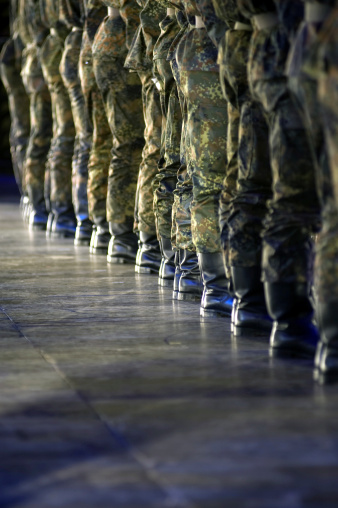 A row of soldiers.The are a part of a drill company during a military show in germany.