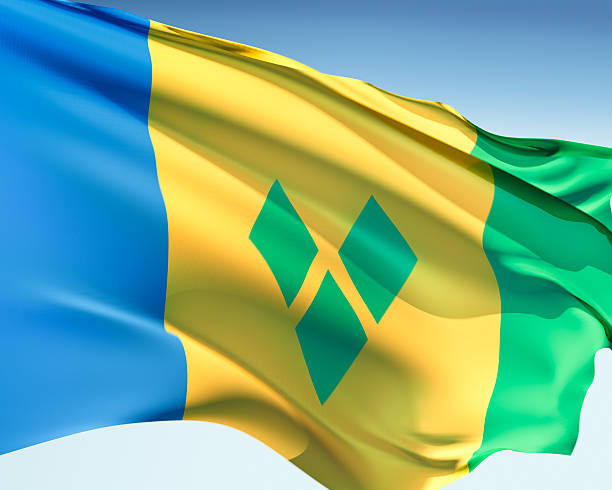 Flag of Saint Vincent and the Grenadines Vincentian flag waving in the wind. Elaborate rendering including motion blur and even a fabric texture (visible at 100%). flag of saint vincent and the grenadines stock pictures, royalty-free photos & images