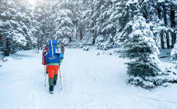 istock tourist with equipment for spending night in winter mountains 1727579651