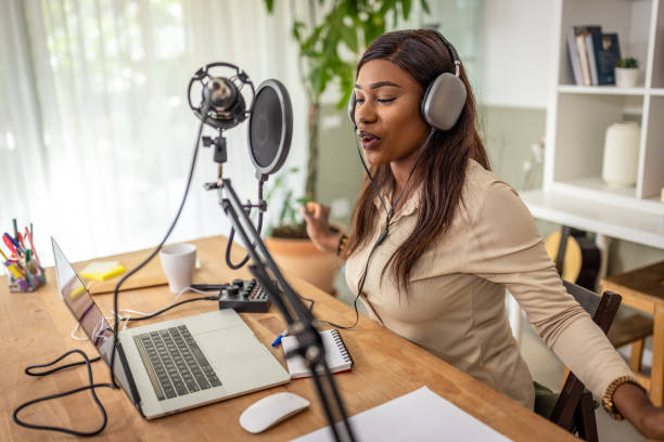 istock Young woman recording podcast 1727585000