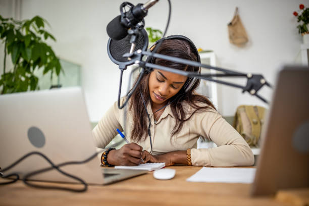 istock Young woman recording podcast 1727586073