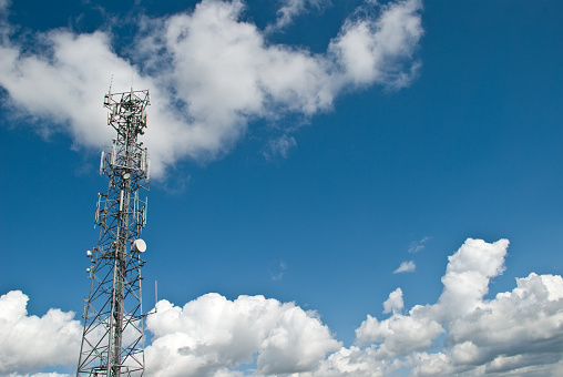 Telecommunications tower for mobile and cell phone use with lots of space for copy.