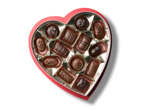 A heart shaped box of chocolates for Valentine's Day.  Isolated on white with clipping path.