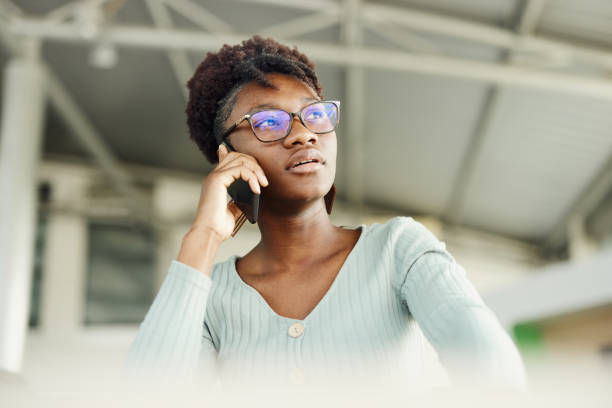 istock Young black woman talking on mobile phone. 1727592018