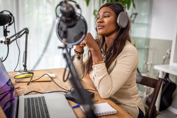 istock Young woman recording podcast 1727592567