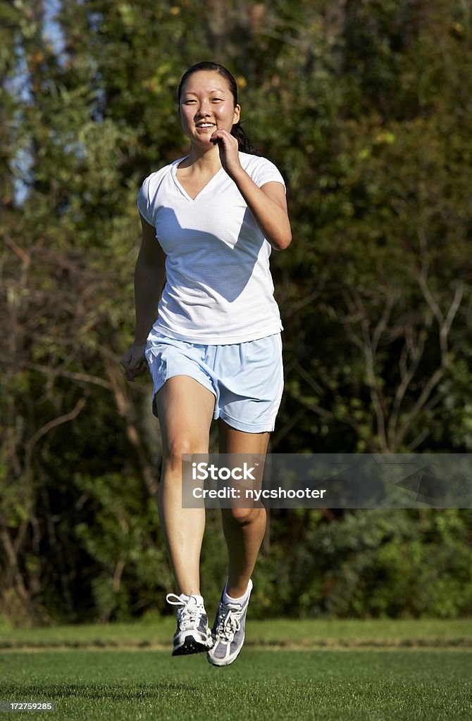 Bambina jogging - Foto stock royalty-free di Donne