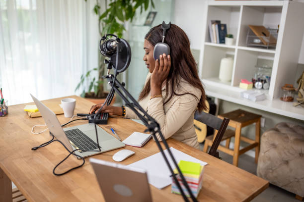 istock Young woman recording podcast 1727594233