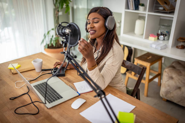 istock Young woman recording podcast 1727594773