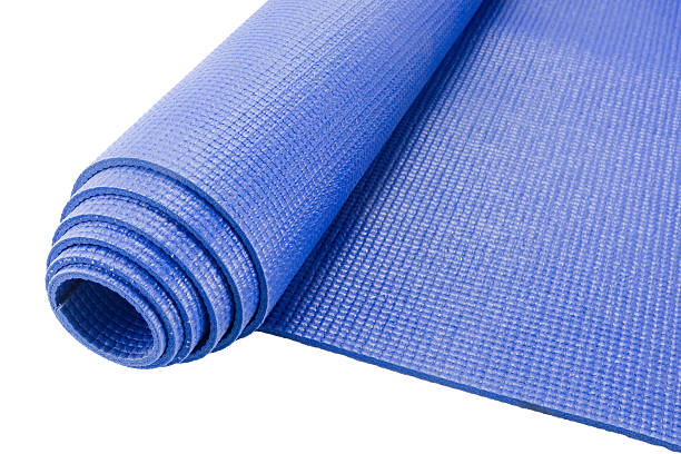 Rolled up yoga mat stock photo