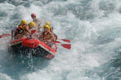 Rafting on white water in a storm
