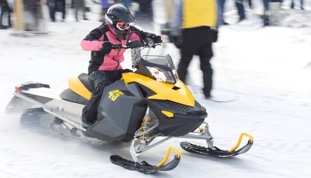 istock Female driver at snowmobile drag races 172760781