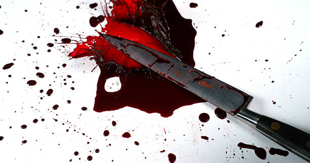 istock Knife with Blood against White Background 1727612328