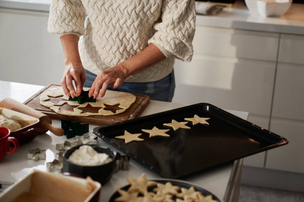 istock Unrecognizable woman preparing dough for gingerbread cookies 1727615119