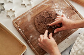 Unrecognizable woman preparing dough for gingerbread cookies