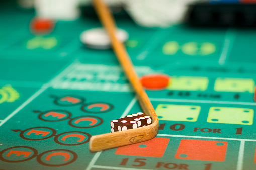 Craps table showing dice and stick