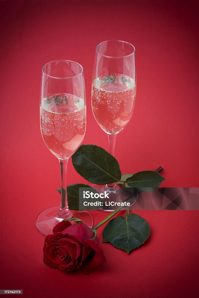 Red rose and two glasses of champagne Champagne Stock Photo