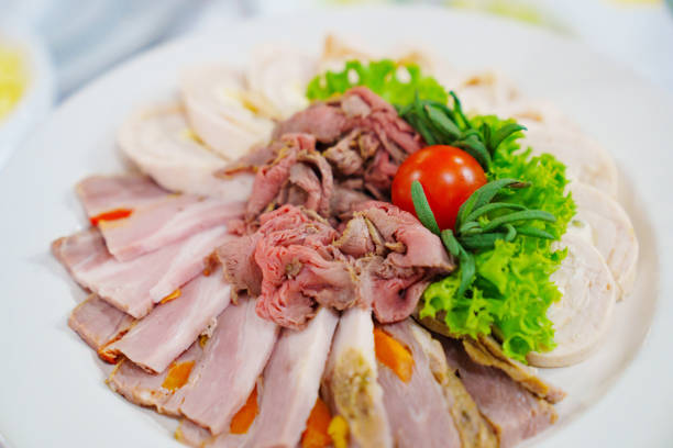 A plate of cold cuts. Meat delicacies for buffets. Gala dinner.