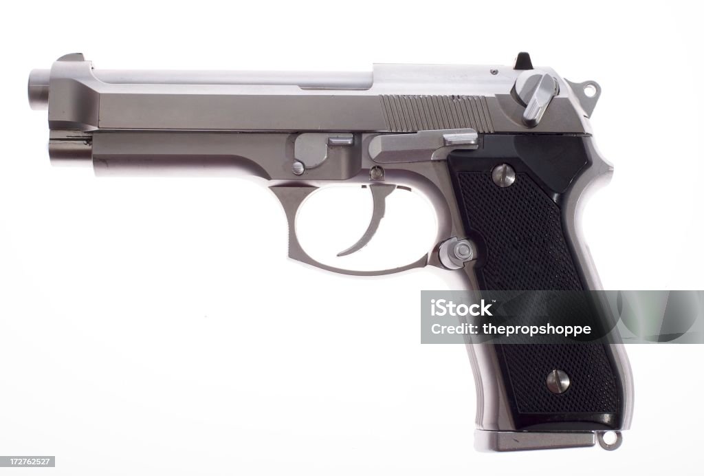 A silver semi auto handgun on white background Silver Semi Auto handgunPlease see other gun and ammunition images in my Black Color Stock Photo