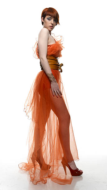 tall female model in orange dress stock photo