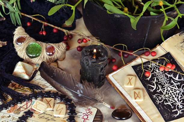istock Tarot cards, runes and magic book of spell on witch table. Occult, esoteric and divination still life. Mystic Halloween background with vintage objects for magic ritual 1727633874