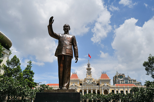 Ho Chi Minh City, Vietnam, 22 August 2023: Ho Chi Minh City Hall or Hotel de Ville was built in 1902-1908 in a French colonial style for the then city of Saigon. It was renamed after 1975 as Ho Chi Minh City People's Committee. In from the Ho Chi Minh Statue.