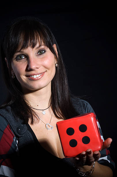 istock Young woman with dice 172764115