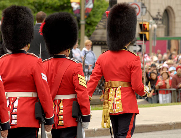 Canada Day Military parade in Ottawa during Canada Day celebration. Ceremonial Honor Guard in traditional British Imperial (XIX century) uniform marching canada day photos stock pictures, royalty-free photos & images