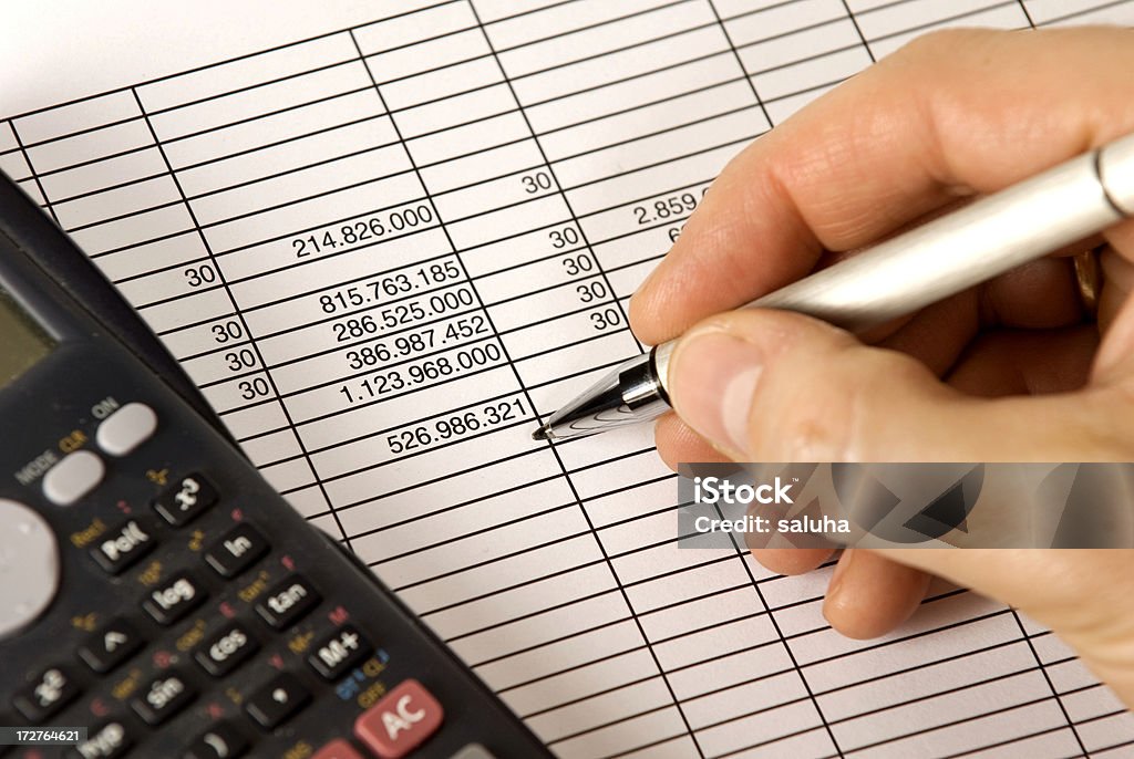 Working about finance Working about finance with calculator. Agreement Stock Photo