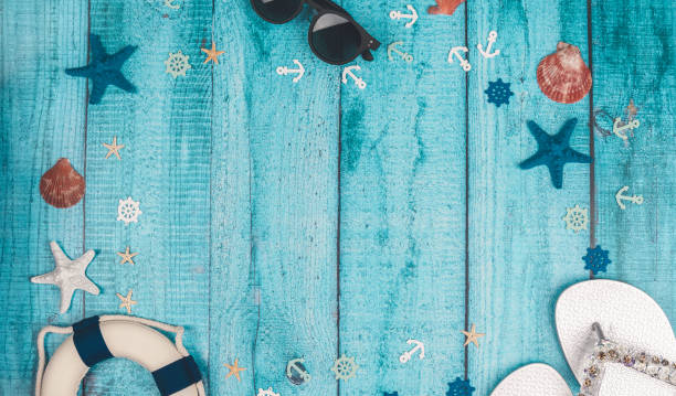 istock Beach accessories on blue board - summer holiday. Flat lay. Top view. Copy space 1727649310