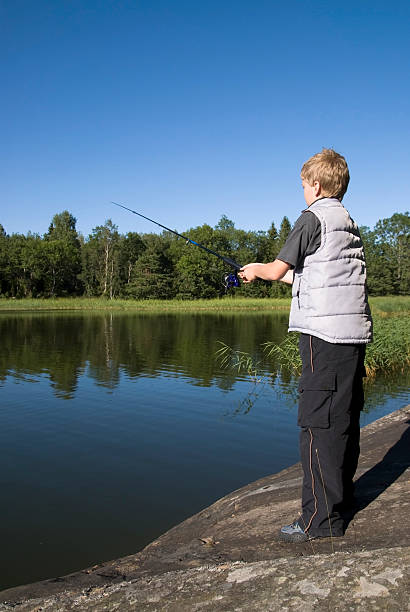 young fisher - sweden fishing child little boys fotografías e imágenes de stock