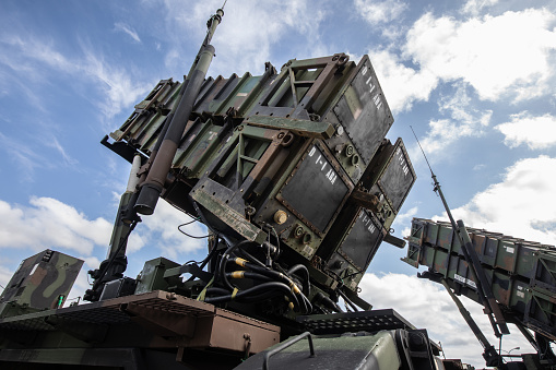 Surface-to-air missiles with radar guidance system pointing to the sky.