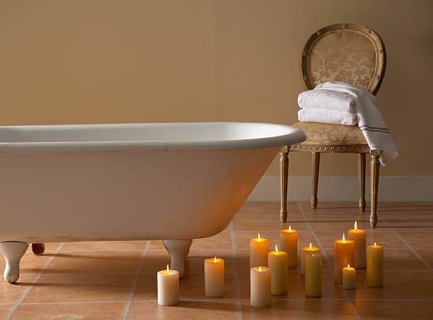 A Bathtub And Lit Candles For Relaxation Stock Photo - Download Image Now -  Bathtub, Candle, Domestic Bathroom - iStock