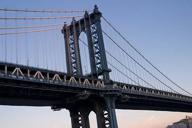 Manhattan Bridge (suspension bridge) with slice of city in background. Connects Lower Manhattan with Brooklyn.