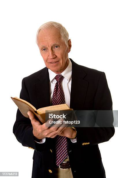 Man In Suit With Open Book Stock Photo - Download Image Now - Bible, Holding, Men