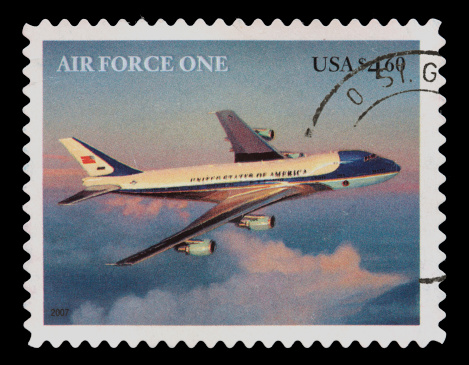 A canceled United States Priority Mail postage stamp with Air Force One. Canon 40D with 100mm macro; no sharpening.