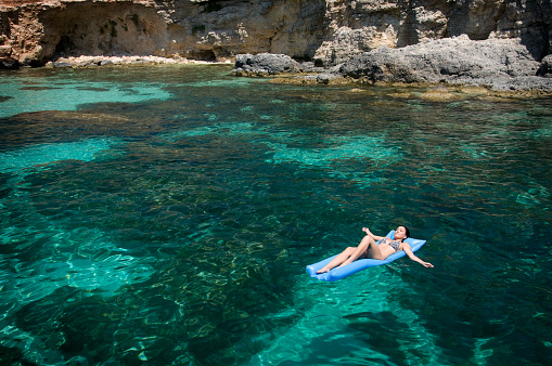 The famous Psarou beach in Mykonos, Greece